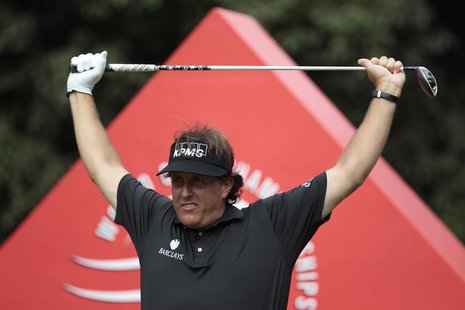 Phil Mickelson of the U.S. exercises before tees off on the 16th hole during the first round of the WGC-HSBC Champions golf tournament in Sh Phil Mickelson of the U.S. exercises before tees off on the 16th hole during the first round of the WGC-HSBC Champions golf tournament in Sh