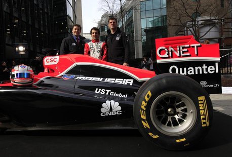 CNBC presenter Ross Westgate (L), Marussia Virgin Formula One driver Timo Glock (C), and the team's Chief Executive Officer, Graeme Lowdon, CNBC presenter Ross Westgate (L), Marussia Virgin Formula One driver Timo Glock (C), and the team's Chief Executive Officer, Graeme Lowdon,