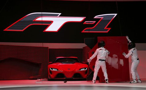 Actors perform as a Toyota FT-1 concept car is unveiled on stage during the press preview day of the North American International Auto Show Actors perform as a Toyota FT-1 concept car is unveiled on stage during the press preview day of the North American International Auto Show