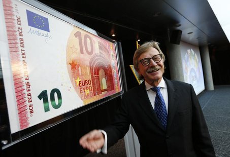 Yves Mersch, Member of the Executive Board of the European Central Bank presents an oversized newly unveiled 10 euro note at the headquarter Yves Mersch, Member of the Executive Board of the European Central Bank presents an oversized newly unveiled 10 euro note at the headquarter