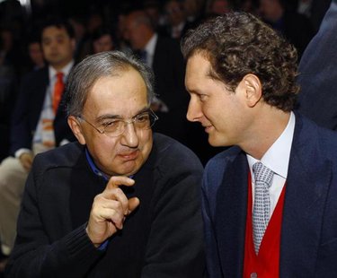 Chrysler-Fiat CEO Sergio Marchionne (L) chats with Fiat Group Chairman John Elkann during the press preview day of the North American Intern Chrysler-Fiat CEO Sergio Marchionne (L) chats with Fiat Group Chairman John Elkann during the press preview day of the North American Intern