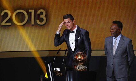 Portugal's Cristiano Ronaldo (L) gestures beside Pele after being awarded the FIFA Ballon d'Or 2013 in Zurich January 13, 2014. Portugal and Portugal's Cristiano Ronaldo (L) gestures beside Pele after being awarded the FIFA Ballon d'Or 2013 in Zurich January 13, 2014. Portugal and