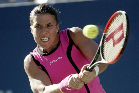 Jennifer Capriati of the United States hits a return to Elena Dementieva of Russia during their semifinal match at the 2004 U.S. Open in New Jennifer Capriati of the United States hits a return to Elena Dementieva of Russia during their semifinal match at the 2004 U.S. Open in New