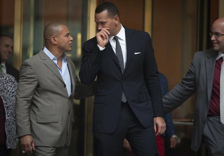 New York Yankees baseball player Alex Rodriguez (C) speaks to Fernando Mateo (L), president of Hispanics Across America, outside the Major L New York Yankees baseball player Alex Rodriguez (C) speaks to Fernando Mateo (L), president of Hispanics Across America, outside the Major L