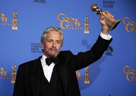 Michael Douglas poses backstage with the award for Best Actor in a Mini-Series or TV Movie for his role in "Behind the Candelabra" at the 71 Michael Douglas poses backstage with the award for Best Actor in a Mini-Series or TV Movie for his role in "Behind the Candelabra" at the 71