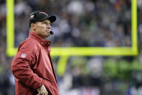 Arizona Cardinals head coach Ken Whisenhunt looks at the game clock during the fourth quarter of their NFL football game against the Seattle Arizona Cardinals head coach Ken Whisenhunt looks at the game clock during the fourth quarter of their NFL football game against the Seattle