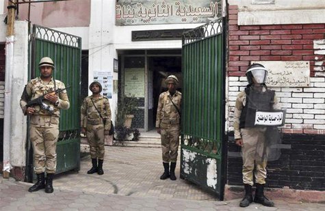 Egyptian soldiers stand guard in the courtyard of a school that will be used as a polling station in downtown Cairo January 13, 2014. REUTER Egyptian soldiers stand guard in the courtyard of a school that will be used as a polling station in downtown Cairo January 13, 2014. REUTER