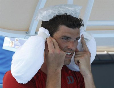 Frank Dancevic of Canada keeps cool with ice packs during a break in play in his men's singles match against Benoit Paire of France at the A Frank Dancevic of Canada keeps cool with ice packs during a break in play in his men's singles match against Benoit Paire of France at the A