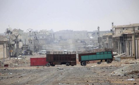 Damaged buildings and vehicles are pictured along a deserted street in the Aleppo town of Naqaren, after forces loyal to Syria's President B Damaged buildings and vehicles are pictured along a deserted street in the Aleppo town of Naqaren, after forces loyal to Syria's President B