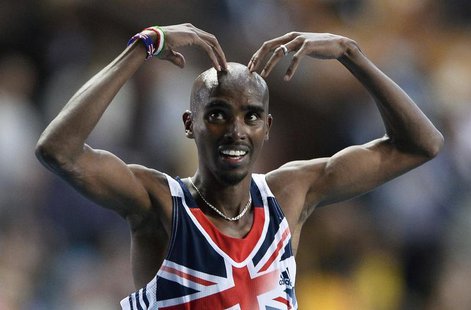 Mo Farah of Britain makes the 'Mobot' pose as he celebrates winning the men's 5,000 metres final during the IAAF World Athletics Championshi Mo Farah of Britain makes the 'Mobot' pose as he celebrates winning the men's 5,000 metres final during the IAAF World Athletics Championshi