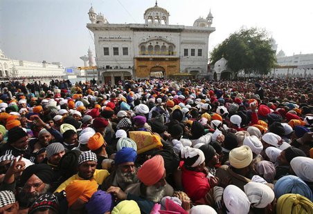 Devotees throng the holy Sikh shrine of Golden Temple to offer prayers for the New Year, in the northern Indian city of Amritsar January 1, Devotees throng the holy Sikh shrine of Golden Temple to offer prayers for the New Year, in the northern Indian city of Amritsar January 1,