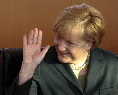 German Chancellor Angela Merkel waves as she leads the first cabinet meeting of the year, at the Chancellery in Berlin, January 8, 2014. REU German Chancellor Angela Merkel waves as she leads the first cabinet meeting of the year, at the Chancellery in Berlin, January 8, 2014. REU