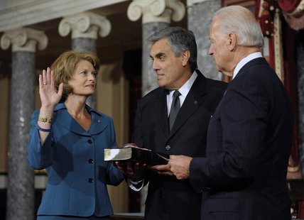 U.S. Senator Lisa Murkowski (R-AK) (L), with her husband Verne Martell (C), takes part in a ceremonial re-enactment of her swearing-in by Vi U.S. Senator Lisa Murkowski (R-AK) (L), with her husband Verne Martell (C), takes part in a ceremonial re-enactment of her swearing-in by Vi