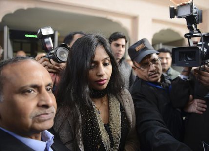 Indian diplomat Devyani Khobragade (C) leaves with her father Uttam Khobragade (L) from the Maharashtra Sadan state guesthouse to meet India Indian diplomat Devyani Khobragade (C) leaves with her father Uttam Khobragade (L) from the Maharashtra Sadan state guesthouse to meet India