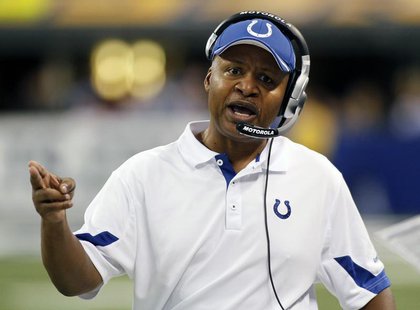 Indianapolis Colts head coach Jim Caldwell talks into his headset during the fourth quarter of their NFL football game against the Jacksonvi Indianapolis Colts head coach Jim Caldwell talks into his headset during the fourth quarter of their NFL football game against the Jacksonvi