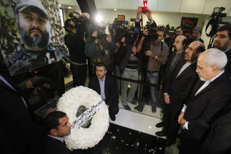 Iran's Foreign Minister Mohammad Javad Zarif (R) and Iran's Ambassador to Lebanon Ghazanfar Roknabadi (2nd R) pay their respect at the grave Iran's Foreign Minister Mohammad Javad Zarif (R) and Iran's Ambassador to Lebanon Ghazanfar Roknabadi (2nd R) pay their respect at the grave