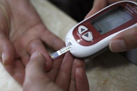 A patient takes a blood glucose test during an event aimed to help people with diabetes to cope with their illness at Saint Luka diagnostics A patient takes a blood glucose test during an event aimed to help people with diabetes to cope with their illness at Saint Luka diagnostics