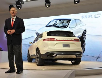 Alan Mulally, President and CEO of Ford, speaks next to the Lincoln MKC Concept crossover vehicle at the North American International Auto S Alan Mulally, President and CEO of Ford, speaks next to the Lincoln MKC Concept crossover vehicle at the North American International Auto S