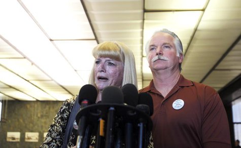 Cathy Thomas (L) speaks next to her ex-husband Ron Thomas at a courthouse news conference after two former policemen were acquitted in the 2 Cathy Thomas (L) speaks next to her ex-husband Ron Thomas at a courthouse news conference after two former policemen were acquitted in the 2
