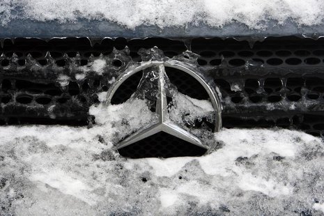 German car manufacturer Daimler's characteristic Mercedes-Benz star is seen covered with snow and ice on a vehicle in Bucharest February 10, German car manufacturer Daimler's characteristic Mercedes-Benz star is seen covered with snow and ice on a vehicle in Bucharest February 10,