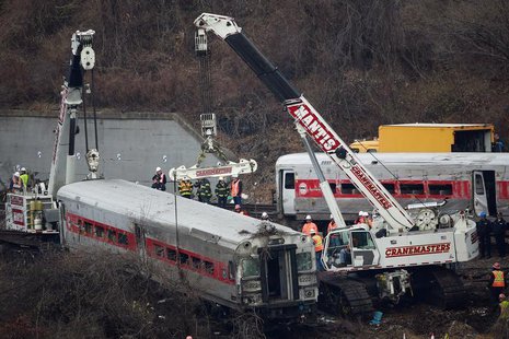The lead car in the Metro-North train derailment is pulled from the marsh in the Bronx borough of New York December 2, 2013. REUTERS/Shannon The lead car in the Metro-North train derailment is pulled from the marsh in the Bronx borough of New York December 2, 2013. REUTERS/Shannon