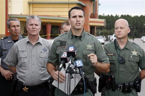 Pasco County Sheriff Chris Nocco (C) speaks to the media as police tape surrounds the Cobb Grove 16 movie theater in Wesley Chapel, Florida, January 13, 2014.
CREDIT: REUTERS/MIKE CARLSON Pasco County Sheriff Chris Nocco (C) speaks to the media as police tape surrounds the Cobb Grove 16 movie theater in Wesley Chapel, Florida, January 13, 2014.
CREDIT: REUTERS/MIKE CARLSON