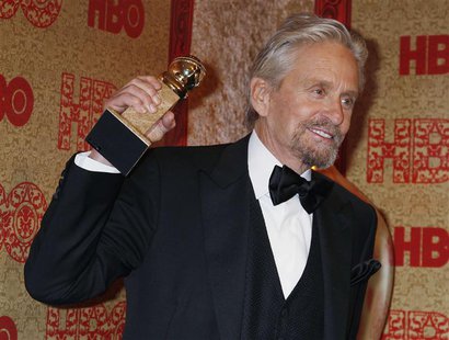 Actor Michael Douglas holds the Golden Globe Award he won as Best Actor, Miniseries or Movie, for his role in HBO's "Behind the Candelabra" Actor Michael Douglas holds the Golden Globe Award he won as Best Actor, Miniseries or Movie, for his role in HBO's "Behind the Candelabra"