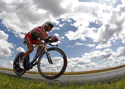 Team Europcar rider and best climber's polka dot jersey holder Thomas Voeckler of France cycles during the individual time trial of the 19th Team Europcar rider and best climber's polka dot jersey holder Thomas Voeckler of France cycles during the individual time trial of the 19th