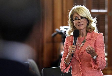 Texas State Democratic Senator Wendy Davis questions the state's Republican Senator Glenn Hegar, sponsor of Senate Bill 1 (SB1), as the stat Texas State Democratic Senator Wendy Davis questions the state's Republican Senator Glenn Hegar, sponsor of Senate Bill 1 (SB1), as the stat