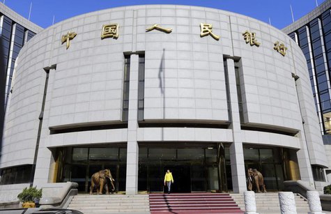 A woman walks out of the headquarters of the People's Bank of China (PBOC), the central bank, in Beijing November 20, 2013. REUTERS/Jason Le A woman walks out of the headquarters of the People's Bank of China (PBOC), the central bank, in Beijing November 20, 2013. REUTERS/Jason Le
