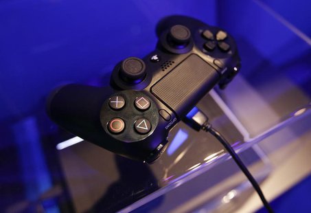 A controller of a Playstation 4 is pictured at the Sony exhibition stand during the Gamescom 2013 fair in Cologne August 21, 2013. REUTERS/I A controller of a Playstation 4 is pictured at the Sony exhibition stand during the Gamescom 2013 fair in Cologne August 21, 2013. REUTERS/I