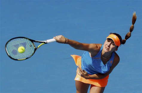 Belinda Bencic of Switzerland serves to Li Na of China during their women's singles match at the Australian Open 2014 tennis tournament in M Belinda Bencic of Switzerland serves to Li Na of China during their women's singles match at the Australian Open 2014 tennis tournament in M