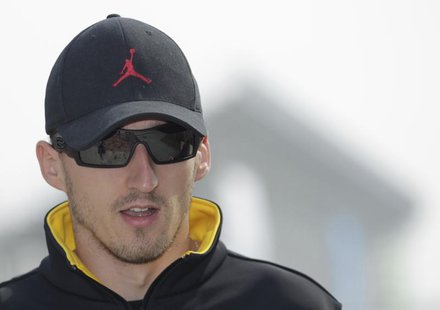 Renault Formula One driver Robert Kubica of Poland arrives at the Korea International Circuit in Yeongam October 21, 2010. REUTERS/Bazuki Mu Renault Formula One driver Robert Kubica of Poland arrives at the Korea International Circuit in Yeongam October 21, 2010. REUTERS/Bazuki Mu
