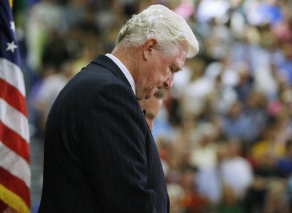 Rep. Jim Moran prays during a town hall style meeting on health care reform at the South Lakes High School gymnasium in Reston, Virginia, Au Rep. Jim Moran prays during a town hall style meeting on health care reform at the South Lakes High School gymnasium in Reston, Virginia, Au