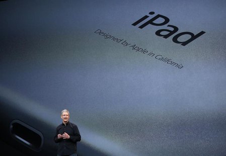Apple Inc CEO Tim Cook speaks about the new iPad Air during an Apple event in San Francisco, California October 22, 2013. REUTERS/Robert Gal Apple Inc CEO Tim Cook speaks about the new iPad Air during an Apple event in San Francisco, California October 22, 2013. REUTERS/Robert Gal