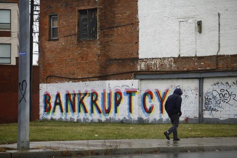 A man walk past graffiti in Detroit, Michigan, December 3, 2013. REUTERS/Joshua Lott A man walk past graffiti in Detroit, Michigan, December 3, 2013. REUTERS/Joshua Lott