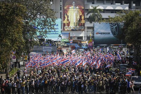 Anti-government protesters march to ministries and other state bodies in central Bangkok January 15, 2014. REUTERS/Damir Sagolj Anti-government protesters march to ministries and other state bodies in central Bangkok January 15, 2014. REUTERS/Damir Sagolj