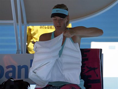 Maria Sharapova of Russia puts on an ice vest during a break in play in her women's singles match against Karin Knapp of Italy at the Austra Maria Sharapova of Russia puts on an ice vest during a break in play in her women's singles match against Karin Knapp of Italy at the Austra