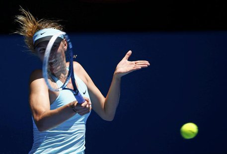 Maria Sharapova of Russia hits a return to Karin Knapp of Italy during their women's singles match at the Australian Open 2014 tennis tourna Maria Sharapova of Russia hits a return to Karin Knapp of Italy during their women's singles match at the Australian Open 2014 tennis tourna