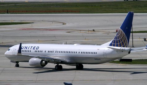 A United Airlines plane with the Continental Airlines logo on its tail, taxis to the runway at O'Hare International airport in Chicago Octob A United Airlines plane with the Continental Airlines logo on its tail, taxis to the runway at O'Hare International airport in Chicago Octob