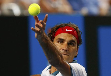 Roger Federer of Switzerland serves to Blaz Kavcic of Slovenia during their men's singles match at the Australian Open 2014 tennis tournamen Roger Federer of Switzerland serves to Blaz Kavcic of Slovenia during their men's singles match at the Australian Open 2014 tennis tournamen