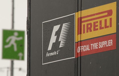 An emergency exit sign is pictured next to a truck of Italian official Formula One tyre supplier Pirelli in the paddock area of the Nuerburg An emergency exit sign is pictured next to a truck of Italian official Formula One tyre supplier Pirelli in the paddock area of the Nuerburg