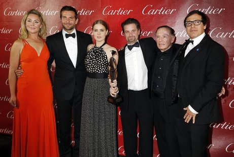 Director David O. Russell (R) and the cast of his film "American Hustle", (from L to R) Elizabeth Rohm, Bradley Copper, Amy Adams, Shea Whig Director David O. Russell (R) and the cast of his film "American Hustle", (from L to R) Elizabeth Rohm, Bradley Copper, Amy Adams, Shea Whig