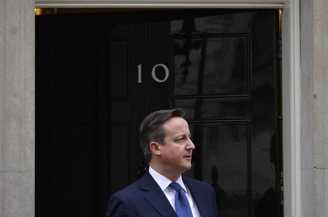 Britain's Prime Minister David Cameron waits to greet Cyprus's President Nicos Anastasiades at Cameron's official residence in Downing Stree Britain's Prime Minister David Cameron waits to greet Cyprus's President Nicos Anastasiades at Cameron's official residence in Downing Stree