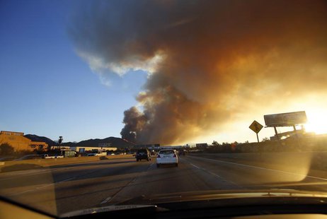 Smoke rises from the Colby Fire seen from the Foothill Freeway approaching Glendora, California January 16, 2014. The fire began early Thurs Smoke rises from the Colby Fire seen from the Foothill Freeway approaching Glendora, California January 16, 2014. The fire began early Thurs