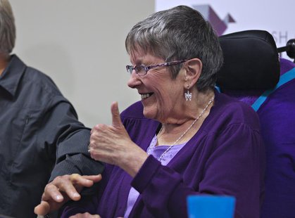 Gloria Taylor gives a thumbs up during a news conference in Vancouver, British Columbia June 18, 2012. Taylor , who suffers from Lou Gehrig' Gloria Taylor gives a thumbs up during a news conference in Vancouver, British Columbia June 18, 2012. Taylor , who suffers from Lou Gehrig'