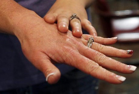 Shauna Griffen (L) and Brooke Shepherd show their rings after getting married at the Salt Lake County Government Building in Salt Lake City, Shauna Griffen (L) and Brooke Shepherd show their rings after getting married at the Salt Lake County Government Building in Salt Lake City,