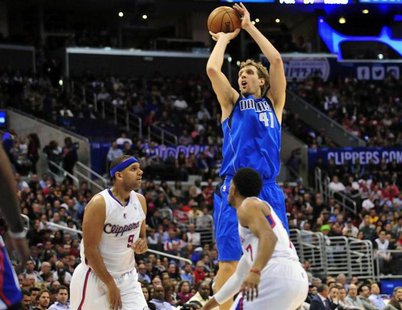 January 15, 2014; Los Angeles, CA, USA; Dallas Mavericks power forward Dirk Nowitzki (41) attempts a three point basket against the Los Ange January 15, 2014; Los Angeles, CA, USA; Dallas Mavericks power forward Dirk Nowitzki (41) attempts a three point basket against the Los Ange