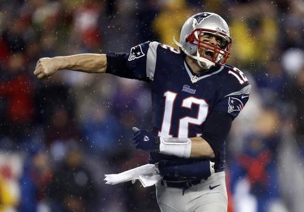New England Patriots quarterback Tom Brady (12) reacts after a touchdown against the Indianapolis Colts in the first half during the 2013 AF New England Patriots quarterback Tom Brady (12) reacts after a touchdown against the Indianapolis Colts in the first half during the 2013 AF