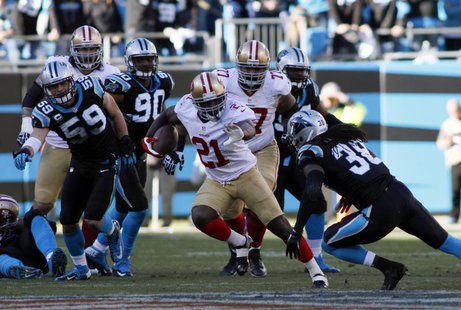 San Francisco 49ers running back Frank Gore (21) runs against Carolina Panthers strong safety Robert Lester (38) during the second half of t San Francisco 49ers running back Frank Gore (21) runs against Carolina Panthers strong safety Robert Lester (38) during the second half of t